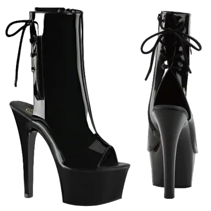 Black high-heeled platform boots with glossy finish on a white background