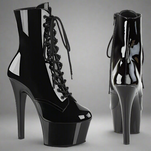 Black high-heeled platform boots with lace-up design on a white background