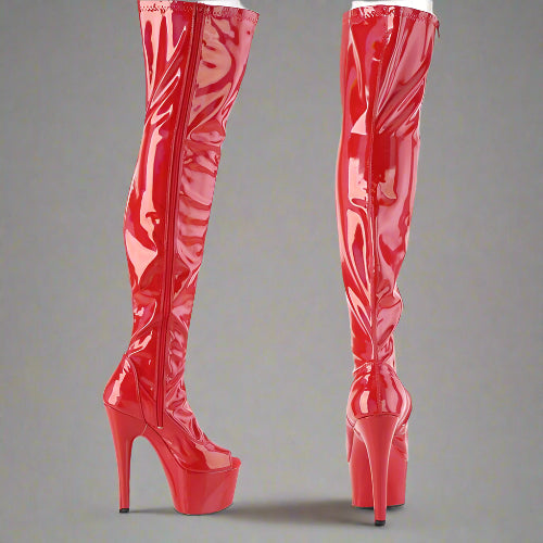 Red high-heeled boots with platform sole on a white background