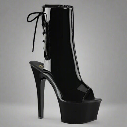 Black high-heeled platform boot on a white background