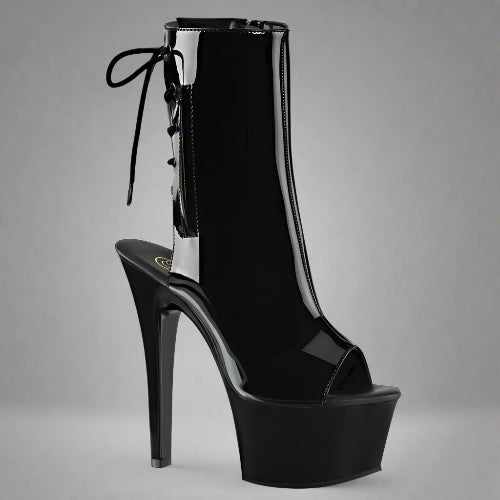 Black high-heeled platform boot on a white background
