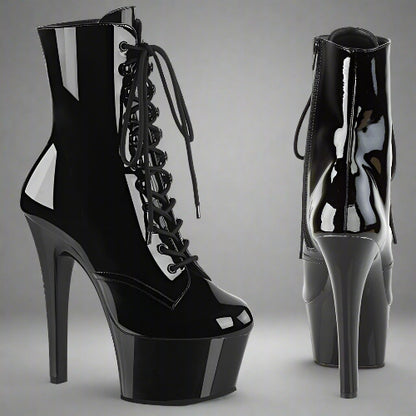 Black high-heeled platform boots with lace-up design on a white background