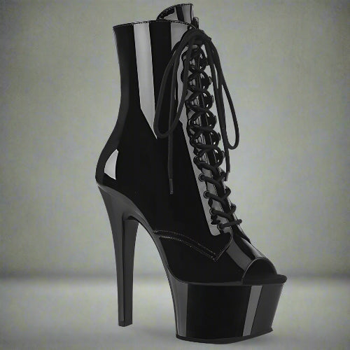 Black high-heeled platform boot with lace-up design on a white background