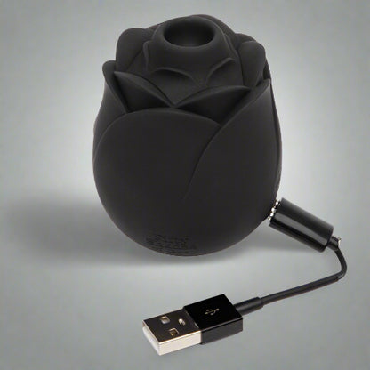 Fifty Shades of Grey 'Hearts & Flowers' in Corpus Christi Black rose-shaped device with a USB cable on a white background