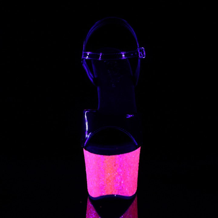 PLEASER SHOES Glowing pink and purple platform shoes on a black background